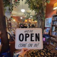 Picture of open sign at Mondragon Books