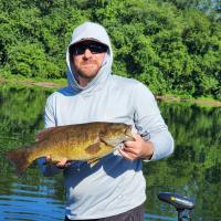 Steve Lowe from Southside Outdoors LLC holding a fish that he caught in the Susquehanna River Valley