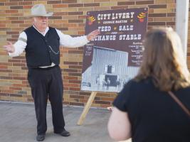 An interpreter with the Sundance Sip n Walk Tour offered each summer in Sundance.