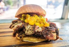 Burger with smoked pork and pineapple chutney.