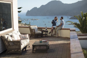 Couple sitting on the deck at Banning House Lodge on Catalina Island