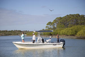 Group Of People Fishing Off A Boat In Daytona Beach, FL