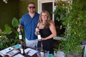 Volunteers Pour Wine at the Wine and Art Stroll