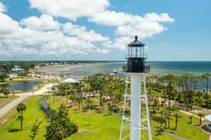 Woman standing at the top of Cape San Blas Lighthouse