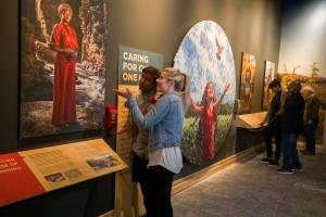 Visitors interact with The Wild Center's Climate Solutions exhibit