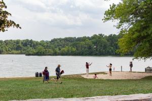 People playing volleyball on the beach area of Blue Marsh Lake