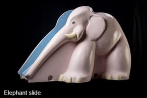 A pink elephant slide for children on a black background.