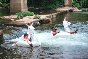 People floating down the river for Floatilla.