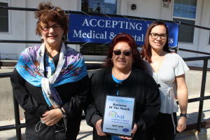 Ovid Community Health Staff Posing with Sept 2020 Bus. of Month Plaque