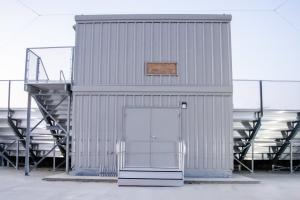 A gray storage room under a press box built by Southern Bleacher in Hamburg, AR