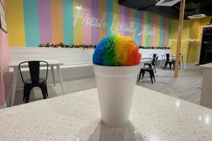Rainbow snowball on table at Slidell Ice Cream Co.