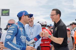 The Governor of Pennsylvania, Josh Shapiro, fist bumping a race car driver