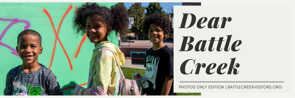 The header image for Dear Battle Creek featuring children smiling at the camera.