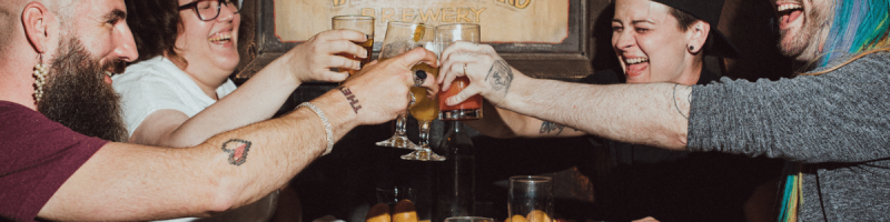 friends cheering with drinks