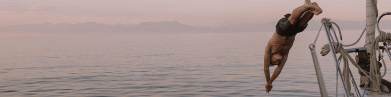 man diving from boat