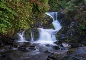 a small waterfall over rocks