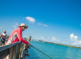 Man fishing from Placida Pier in Punta Gorda/Englewood Beach