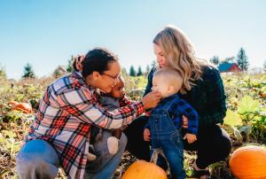 family in the pumpkin patch