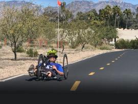 Riding a hand bike on the loop