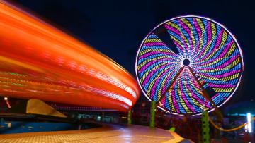The Ferris wheel lights up the night at the New York State Fair