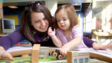 A mother and daughter play at the Rochester Museum & Science Center