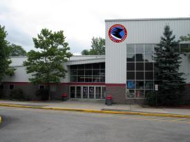 The outside of the Westchester Skating Academy with large windows.
