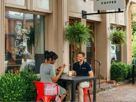 A couple dining on a patio in German Village