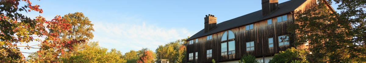 Exterior of the Glasbern Packhouse among the fall foliage