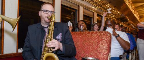 Saxophone player on a train for the Jazz Wine Trail event in Grapevine, TX