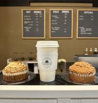 Picture of hot coffee and muffins at The Grindstone