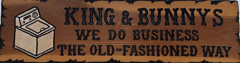 King and Bunny's wood sign that states "We do business the old-fashioned way."