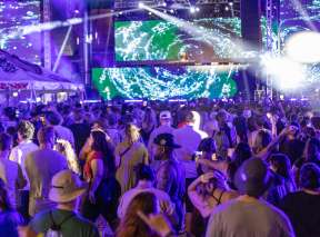 Crowds enjoy an outdoor concert at WAVE
