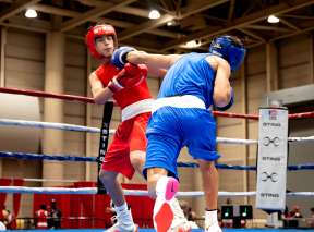 Two boxers battle in a match during a USA Boxing event at Century II