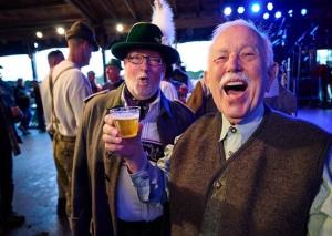 Two men enjoying a beer at Oktoberfest