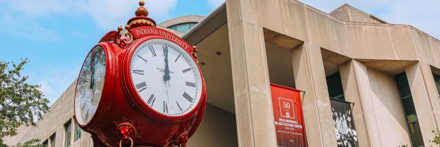 A red clock tower on IU's campus