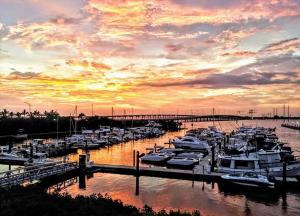 View of the marina and Punta Gorda bridges from Laishley Crab House deck at sunset