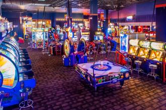 Aerial view of arcade with games and air hockey table in center