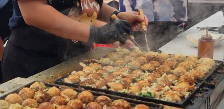 Person preparing food at McKinney Asian Festival
