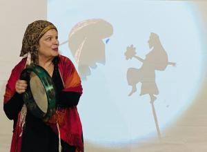 Matriarch performing puppetry