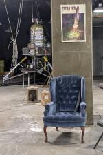 An armchair sits in front of a lunar lander prototype in the workshop of a converted Atlas E missile silo near Cheyenne, Wyoming