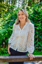 Woman in white blouse outside