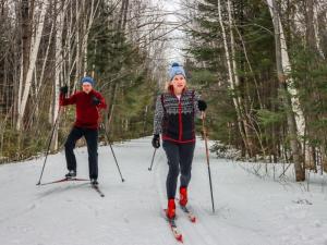 Couple Cross Country Skiing at Howl Adventure Center