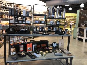 A display at One Good Woman shows the different coffee and tea options available for sale.