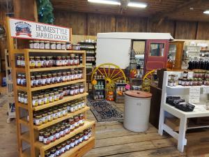 Display of items for sale at the Point Barn Pantry with Amish Buggy as part of the display.