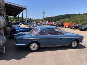 Line-up of classic cars at a car show at Dominio IV