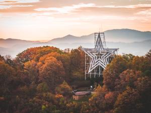 Roanoke Star surrounded by fall foliage.