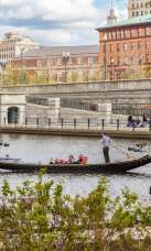 People taking a ride through Waterplace Park with La Gondola.