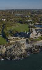 Aerial view of Newport Rhode Island on ocean shows historic mansions