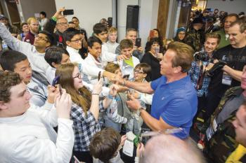 Arnold Schwarzenegger surrounded by fans at his Sports Festival