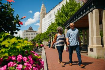 Black woman and white man walking on Scioto Mile